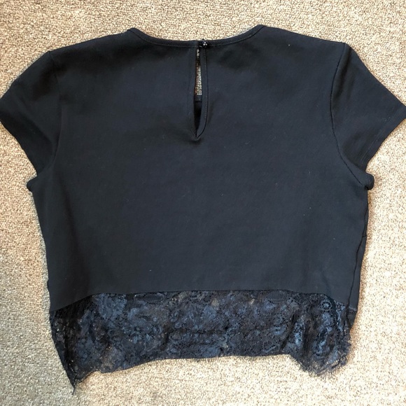 A black crop top with lace on the bottom - Picture 2 of 2